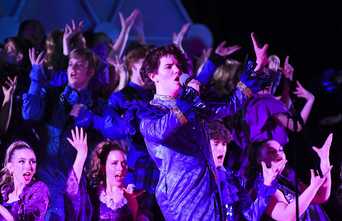 Members of The All Americans of ETC School of Musical Arts in Akron, Ohio, perform Saturday during the Jay County Show Choir Spectacular at Jay County Junior-Senior High School. The group went on to win the competition. Rouge, ETC’s all-girl group, finished in second place while Vocal Pointe of Columbus North took third. Jay County’s Patriot Edition and Just Treble groups performed in exhibition. They will begin their competitive seasons on Feb. 1 at Northrop. (The Commercial Review/Ray Cooney)