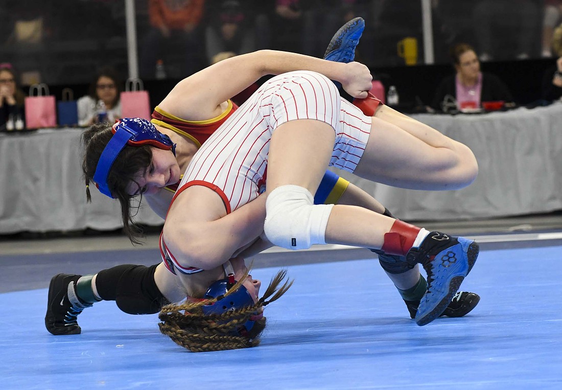 Jay County High School’s No. 5 Katie Rowles tries to gain control of No. 2 Claire May of Roncalli during the 100-pound third place match at the IHSAA state finals on Jan. 17 at Cortiva Coliseum. “I'm really excited for Team state,” Rowles said. “Not very many girls throughout the state get the opportunity to compete again after the state series, so this is really exciting, especially as the first team state tournament. And I think we've got a really good shot at doing well, maybe even taking on the title.” (The Commercial Review/Andrew Balko)