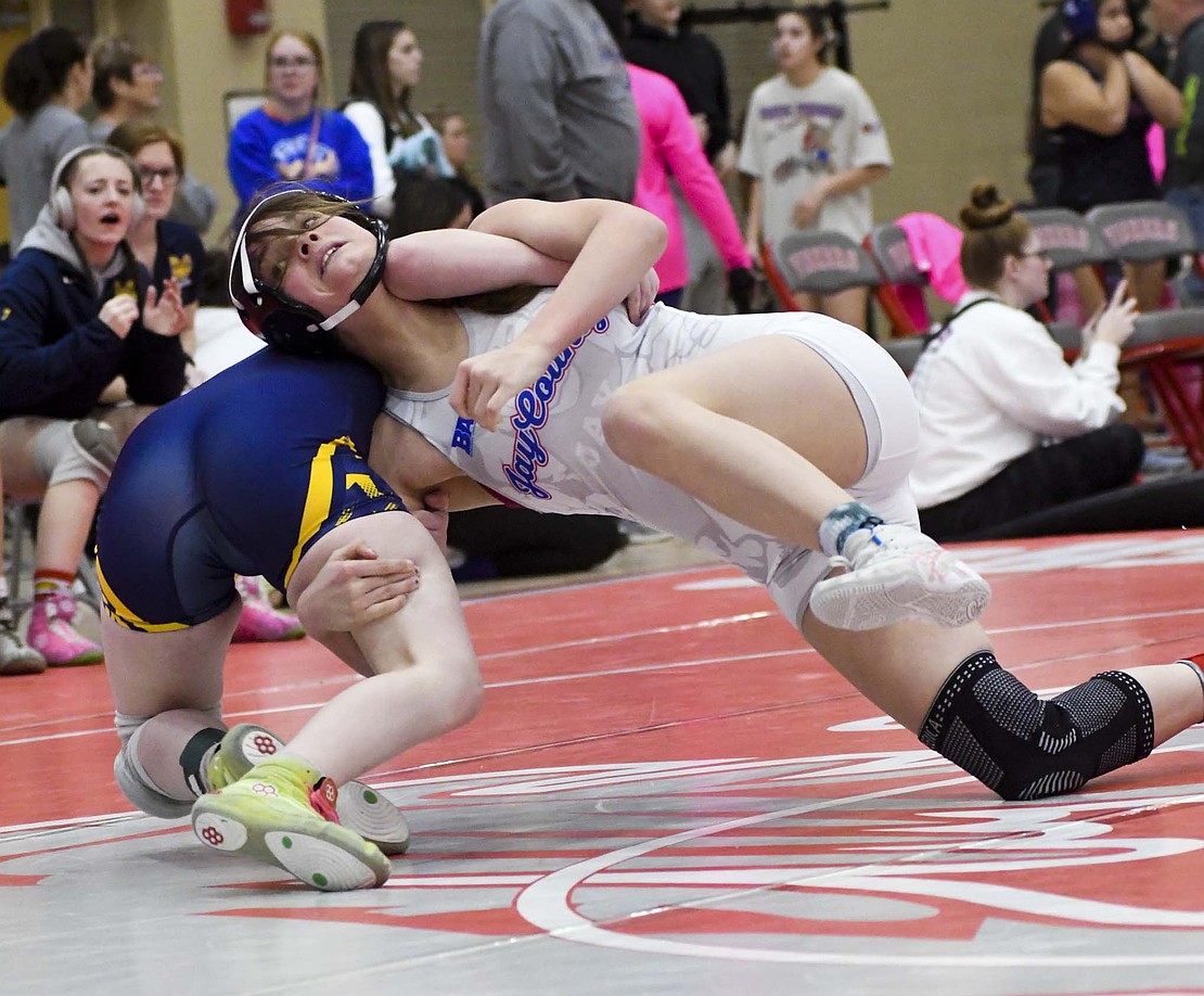 Jay County High School’s Reagan VanSkyock hits No. 4 Maddison Whitted of Mooresville with a single-leg takedown late in the first period of the 130-pound match at the IHSGWCA Girls Team State Duals on Saturday at Fishers. The Patriots beat MHS 47-30 to claim a top-four spot. (The Commercial Review/Andrew Balko)