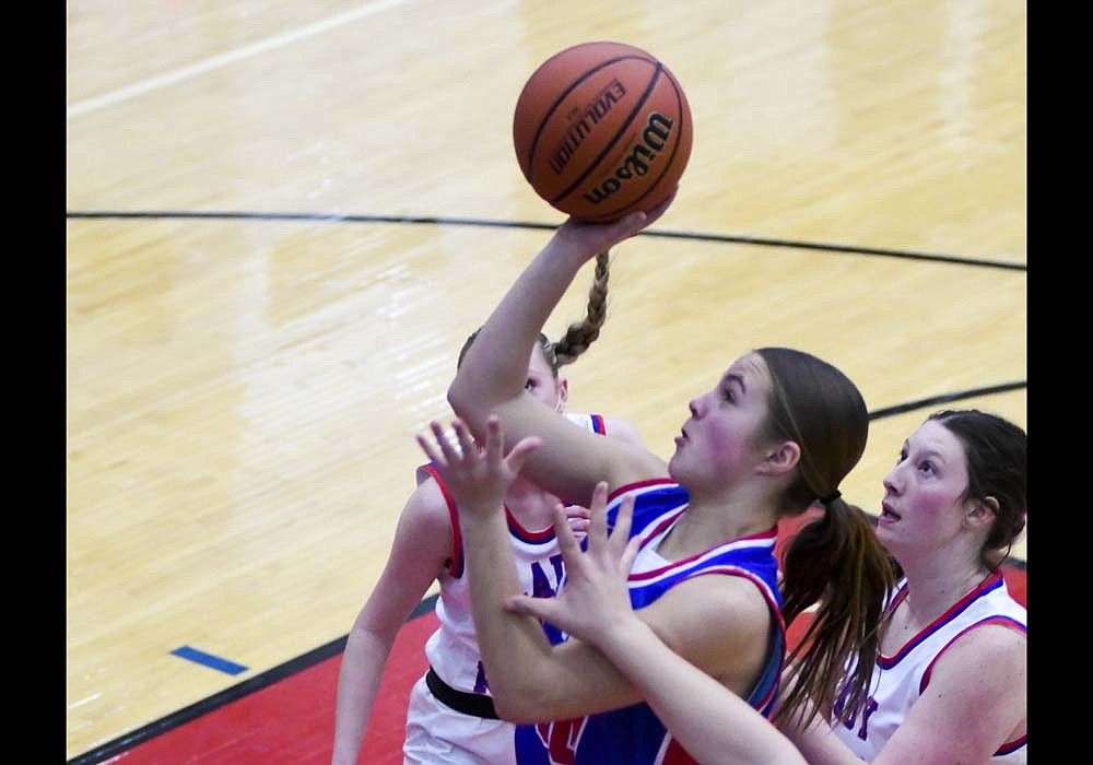 Elizabeth Brunswick of Jay County High School drives for a layup during the first half of the Patriots' 52-34 win Saturday night at Southern Wells. Brunswick finished with eight points to go along with team highs of nine rebounds and five assists. (The Commercial Review/Ray Cooney)