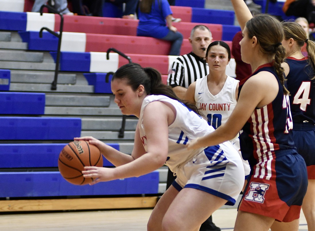 Alice Ometti of Jay County High School dribbles during the fourth quarter of a 57-29 victory Tuesday over visiting Heritage. Ometti, an exchange student from Italy, grabbed two rebounds in her varsity debut. (The Commercial Review/Ray Cooney)