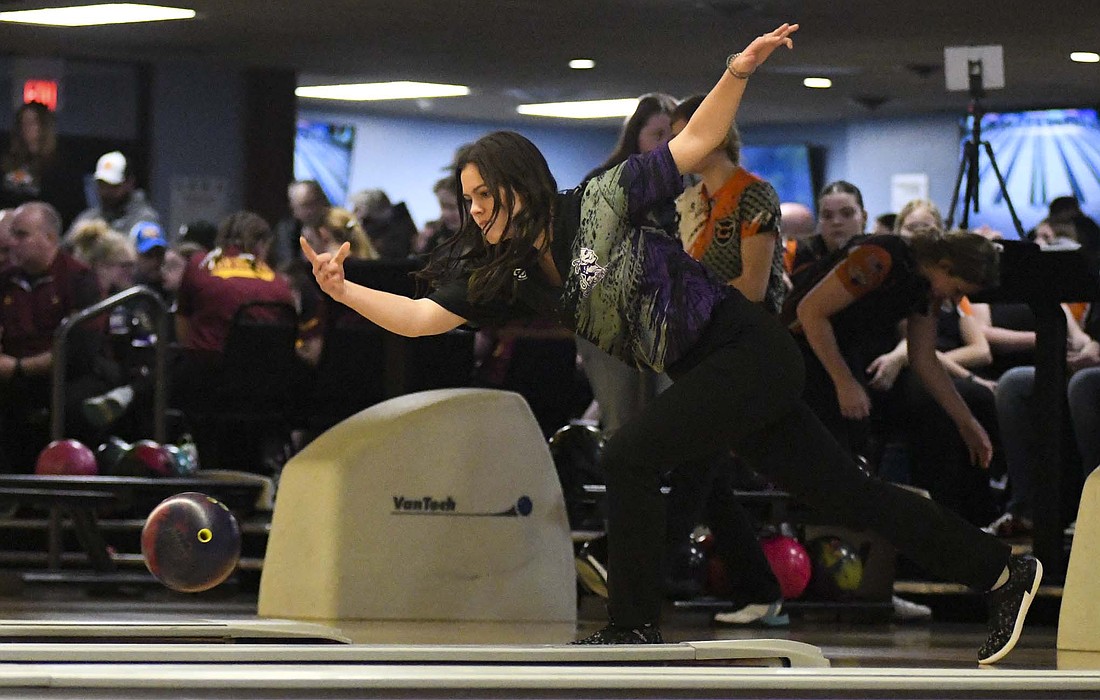 Kayla Heitkamp releases her Storm Phaze II during the first round of Tuesday’s Midwest Athletic Conference girls bowling tournament at Community Lanes in Minster. Heitkamp finished with the Indians’ fifth-best fill (58.3%) and strike (29.7%) percentages, as the Tribe clinched its second straight MAC title. After a first round bye, Fort Recovery swept Minster 175-119, 170-136, 167-114 before falling to Versailles in the championship 161-142, 148-183, 169-166, 190-180 to allow the Tigers to claim the title of co-champions. (The Commercial Review/Andrew Balko)