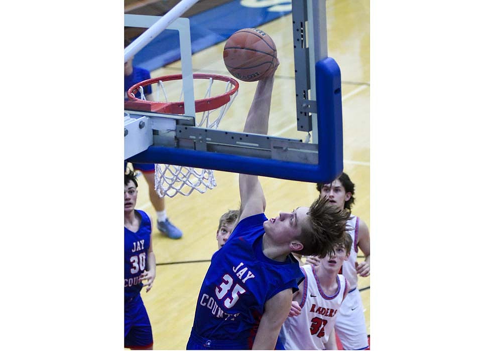 Gradin Swoveland of Jay County High School rises up for a dunk attempt during the Patriots’ 77-25 victory at Southern Wells on Thursday. Swoveland scored nine points in the contest, while adding two assists. (The Commercial Review/Andrew Balko)