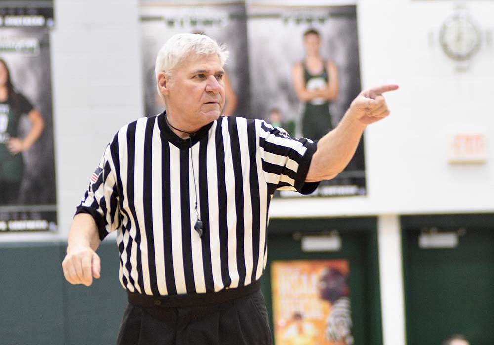 Referee Randy Miller of Portland makes a call Friday night during the Class 1A Sectional 56 semifinal game between Lincoln and the host Randolph Southern Rebels. Meanwhile in Connersville, the Jay County High School girls basketball team’s season came to an end with a 59-36 loss to the Delta Eagles. (The Commercial Review/Ray Cooney)