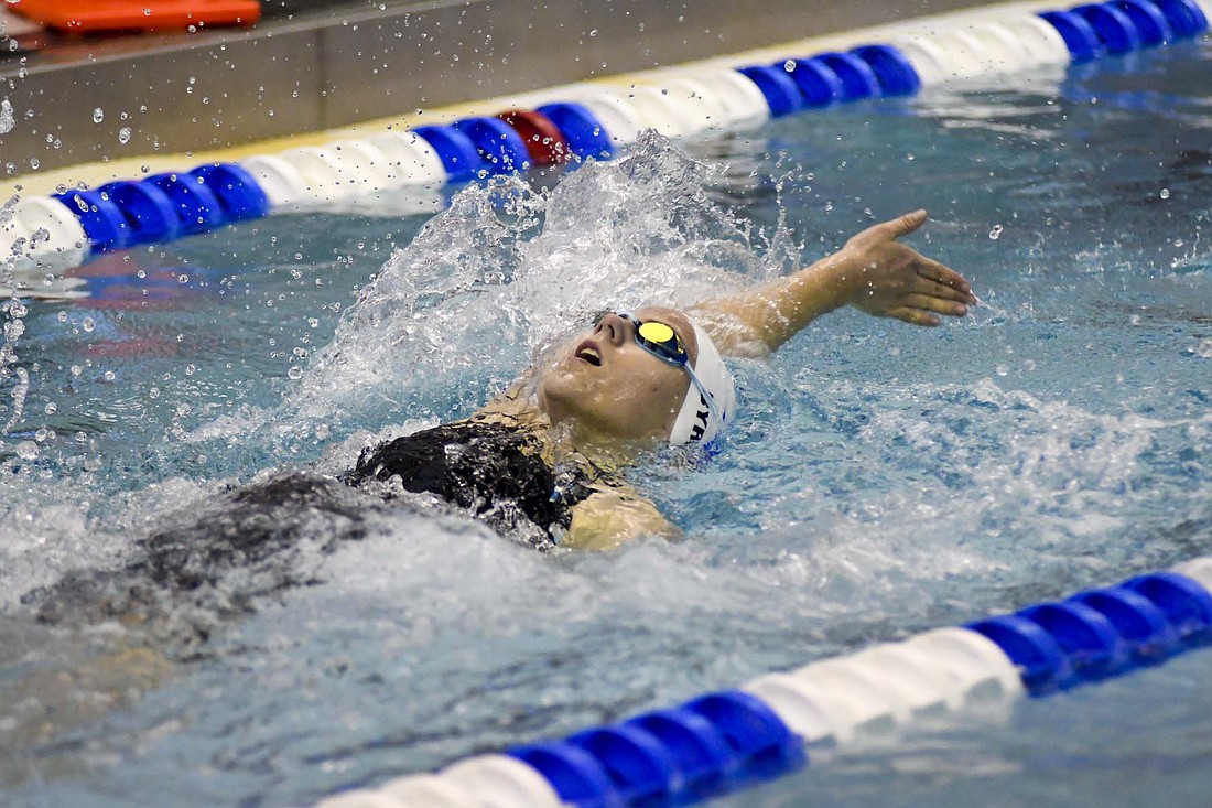 Jay County High School freshman Brooklynn Byrum swims the backstroke leg of the 200-yard individual medley during the IHSAA Sectional 7 Jay County hosted on Monday. Byrum competed in four events, placing seventh in both the IM and 100 butterfly to help the Patriots to finish fourth with 234 points. (The Commercial Review/Andrew Balko)