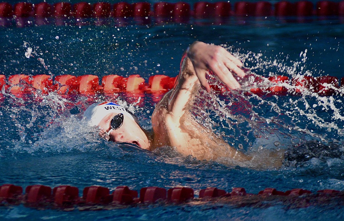 Carson Westgerdes, a Jay County High School freshman, swims the 200-yard freestyle during Thursday’s sectional preliminaries. Westgerdes earned the No. 7 seed in the event and teamed with Cooper Glentzer, Peyton Yowell and Lincoln Clamme for the No. 4 seed in the 400 freestyle relay. (The Commercial Review/Ray Cooney)