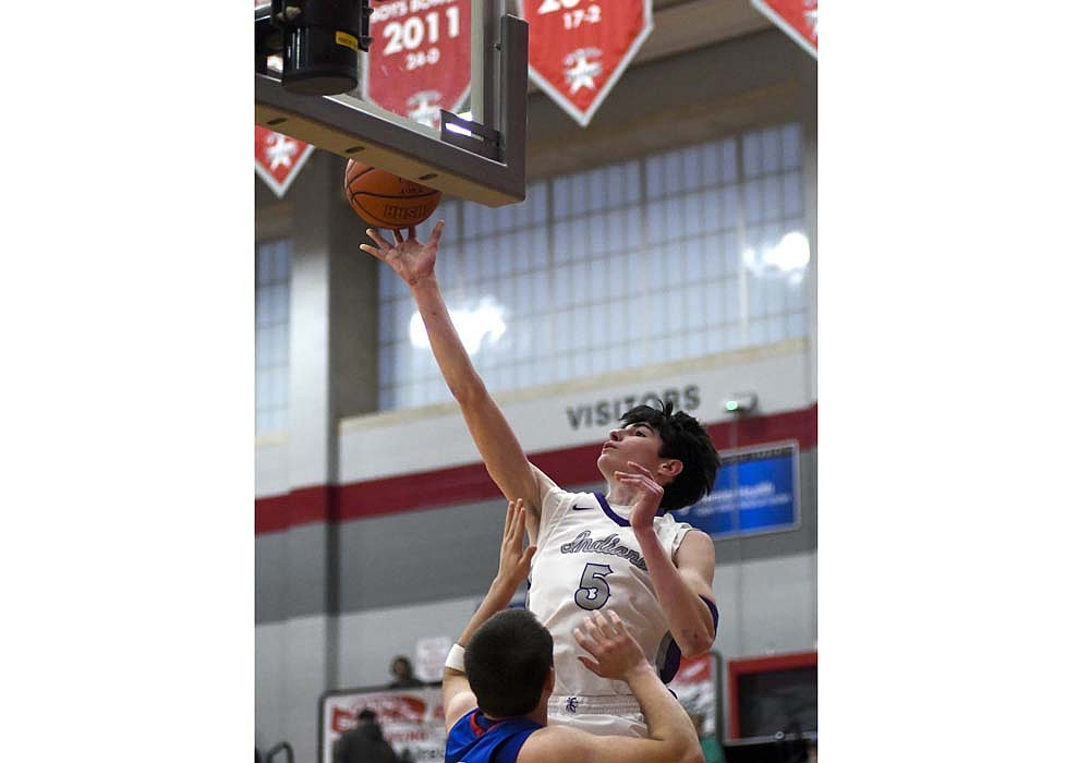 Brody Barga of the Fort Recovery boys basketball team puts up a bunny during the OHSAA Division VI Southwest 1 district opener victory over Riverside at Troy on Wednesday. Barga led the Indians with 14 rebounds and three assists, while putting up eight points in the 54-37 win. (The Commercial Review/Andrew Balko)