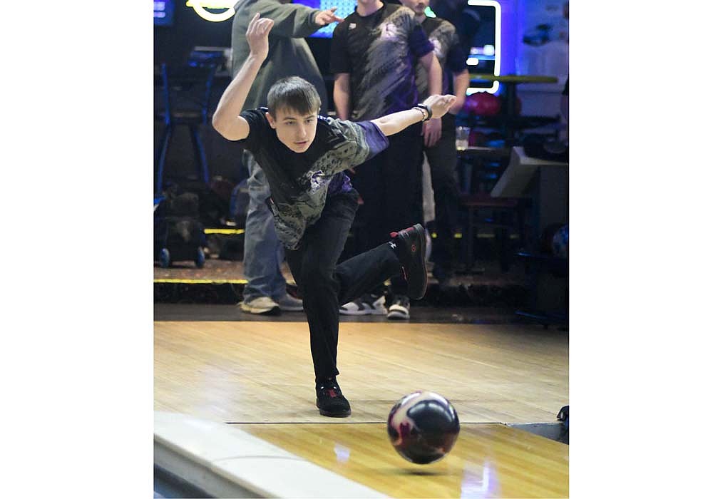 Fort Recovery High School’s Anthony Roessner follows through after rolling his ball at Monday’s practice at Miracle Lanes. Roessner and the other Indians will travel to H.P. Lanes in Columbus for their first trip to the state tournament in program history. (The Commercial Review/Andrew Balko)