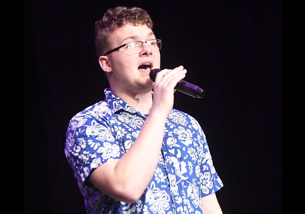 Caden Marchal, a Fort Recovery High School senior, sings his original song “In the Stars” on Sunday evening during the junior high and high school cabaret concert in the auditeria at Fort Recovery Elementary/Middle School. Marchal also sang “Let it Be” by The Beatles as part of a trio with his brother Matthew and Andy Niekamp. (The Commercial Review/Ray Cooney)