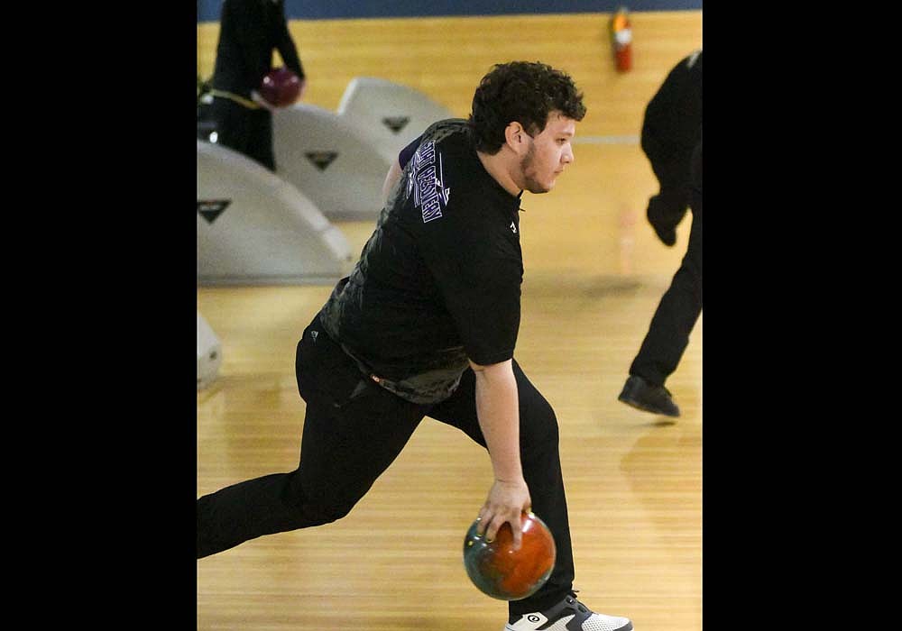 Riley Grieshop of the Fort Recovery High School boys bowling team bottoms out on his swing while throwing a practice shot at H.P. Lanes in Columbus on Saturday during the OHSAA Division II State Bowling Tournament. Grieshop threw a 225 in the first individual game to help the Indians to an 11th-place finish. FRHS fell 72 pins short of placing in the top eight teams to advance to bracket play. (The Commercial Review/Andrew Balko)