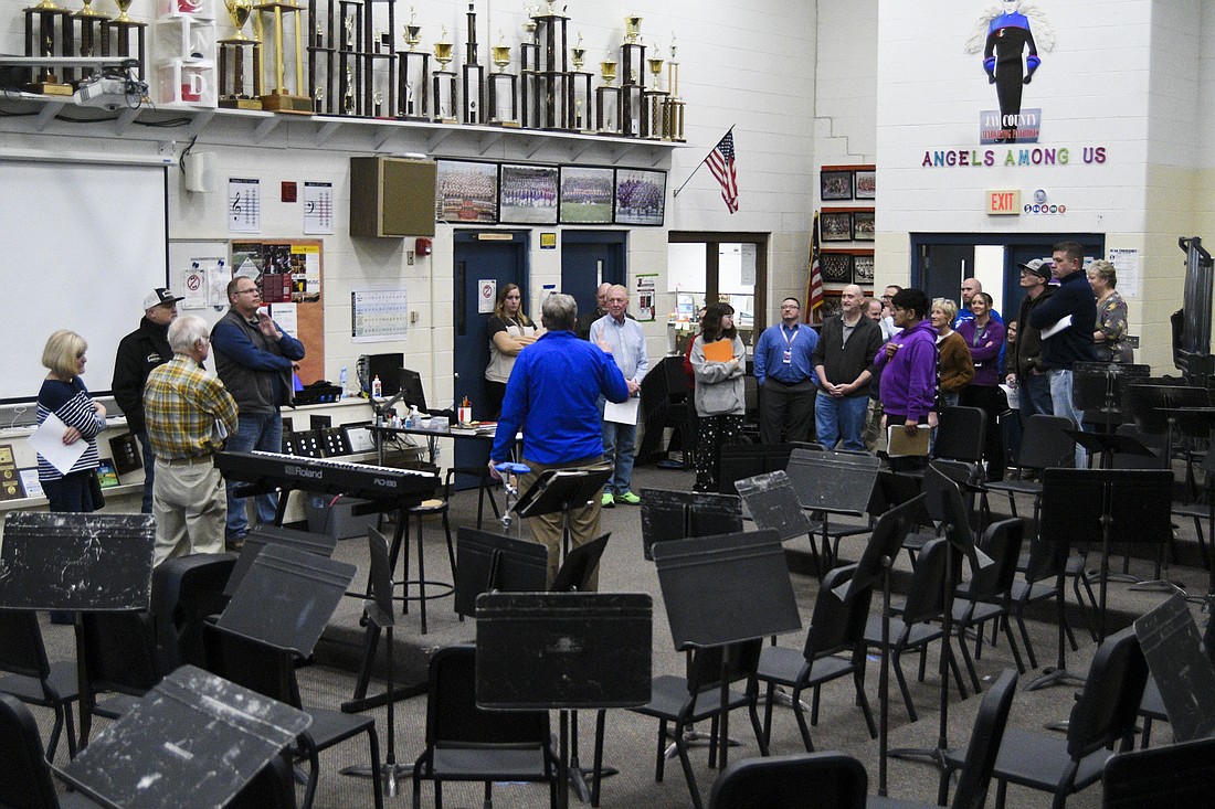 Jay School Board members and others toured Jay County Junior-Senior High School on Monday evening to look at areas being considered for a capital improvement project. Pictured, Jay Schools superintendent Jeremy Gulley explains some of the areas of concern in the band room. The board also visited the choir room, television studio, wrestling rooms, kitchen and pool. Plans are to hold a work session on Monday, March 31, to discuss options for a capital project with a target of making a decision in May. (The Commercial Review/Ray Cooney)