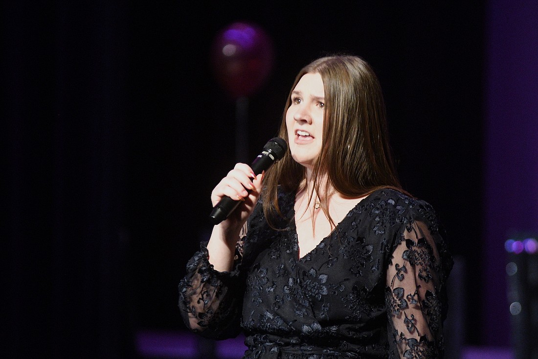 Grace Lochtefeld sings “Hopelessly Devoted to You” from “Grease” on Sunday during the Fort Recovery junior high and high school cabaret concert. The three-hour event featured performances of popular songs by individuals, duets and small groups. (The Commercial Review/Ray Cooney)