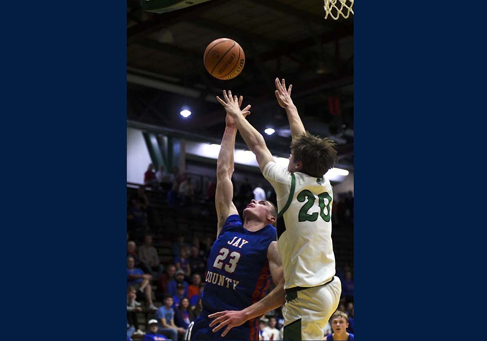 Jay County High School’s Eli Dirksen goes up for a layup against Evan Manor of Yorktown during a 69-45 loss in the IHSAA Class 3A Sectional 24 opener at New Castle on Tuesday. The senior started the second half to ramp up the defensive pressure on the Tigers in an attempt to erase a 22-point deficit. (The Commercial Review/Andrew Balko)