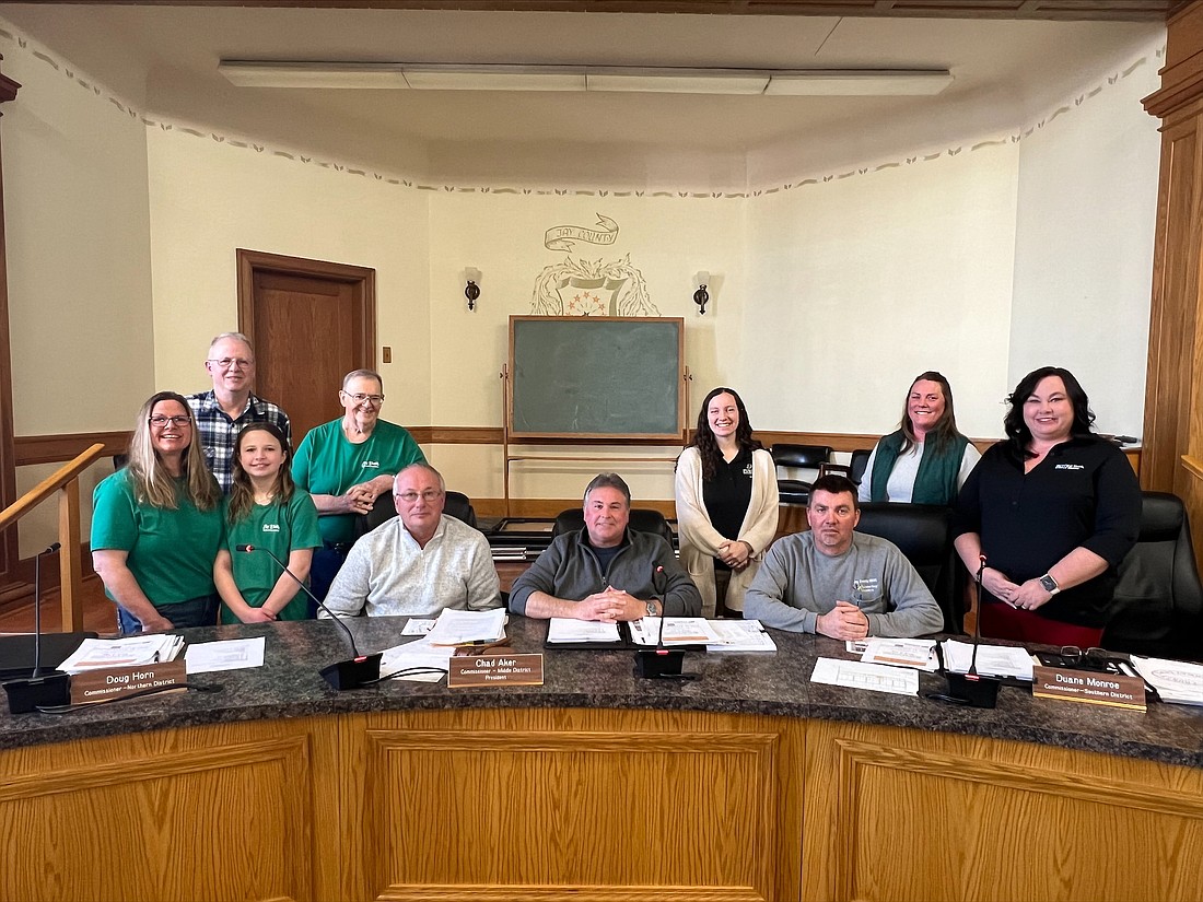 Jay County Commissioners signed a proclamation Monday declaring March 17 through 23 as Agriculture week in Jay County. Pictured, from left, are agriculture committee members Jenny Wagner, Larry Temple, Piper Wagner and Don Shauver, commissioners Doug Horn and Chad Aker, agriculture committee member Emily Kring, commissioner Duane Monroe, and agriculture committee members Allison Keen and Angela Paxson. The ag breakfast — a meal of scrambled eggs, bacon, sausage, toast and beverages for a free-will donation — is scheduled for 5 to 9 a.m. Tuesday, March 19, at Jay County Fairgrounds. (Photo provided)