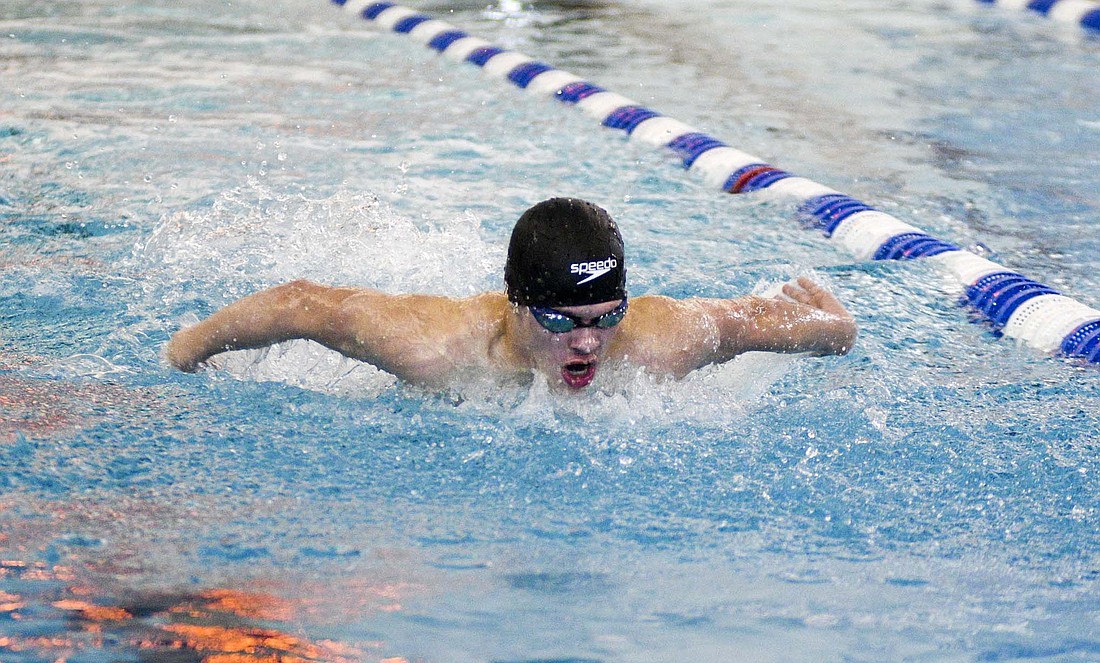 Grady Warvel swims the butterfly leg of the 200-yard medley relay for the Jay County Junior High School swim team during the Allen County Athletic Conference championship hosted by the Patriots on Friday. After helping the relay team take first place, Warvel picked up a pair of individual victories, including the 100 individual medley, in which he broke the meet and school records. (The Commercial Review/Ray Cooney)