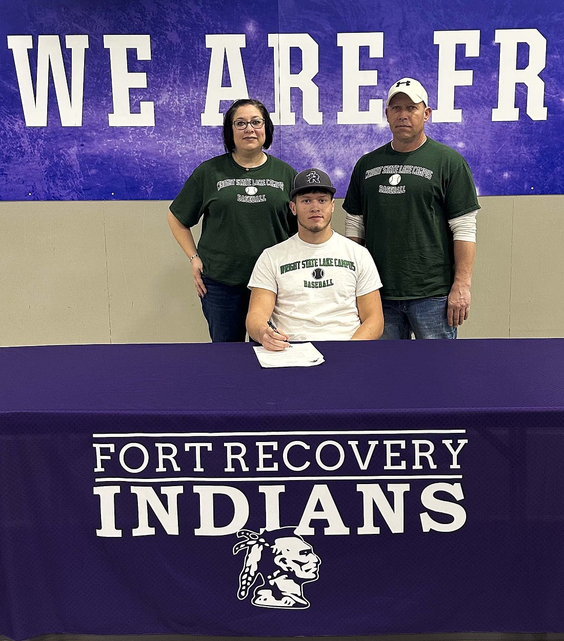 Caden Grisez, a senior at Fort Recovery High School, recently signed his National Letter of Intent to play baseball at Wright State University Lake Campus. Pictured is Caden Grisez with his mother Jessy and father Tony. (Photo provided)