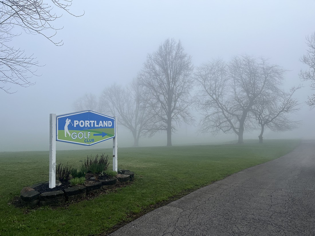 Foggy conditions crept into Jay County after 7 a.m. Thursday. Pictured, fog shrouds Portland Golf Club in this view from its entrance on county road 200 South. Cooler temperatures will remain today and tomorrow before climbing into the 60s Sunday and then a high of 70 on Monday. (The Commercial Review/Ray Cooney)