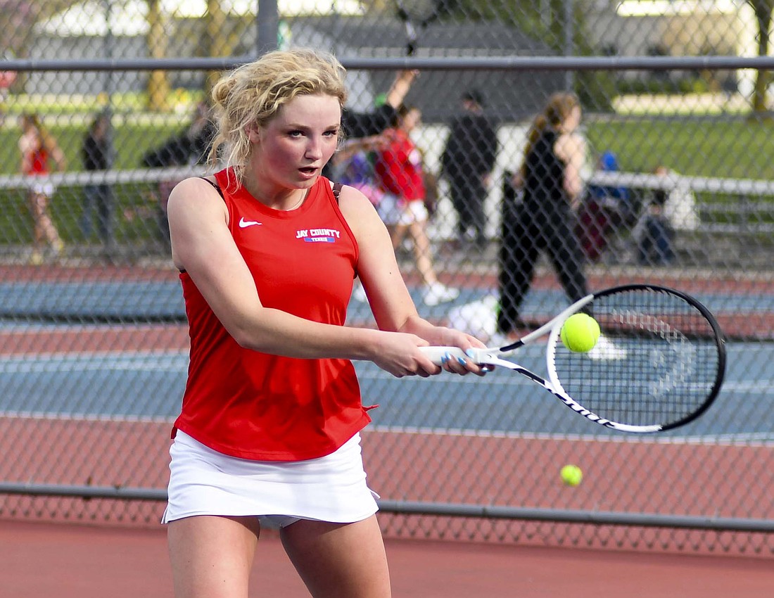 Tessa Frazee of the Jay County High School girls tennis team hits a forehand during the Patriots 4-1 victory on Monday. Frazee clinched the match with a 6-4, 6-1 win over Winchester Community’s Karina Jarrett and claimed her first career victory. (The Commercial Review/Andrew Balko)
