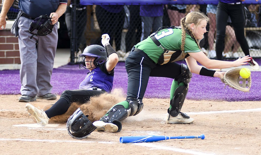 Fort Recovery High School freshman Paisley Hart slides in safely before Anna’s catcher, Izzy Jenkins, can attempt a tag during the Indians’ 12-1 win on Tuesday. Hart scored three runs in the win that featured Emma Will breaking the school record in hits. (The Commercial Review/Andrew Balko)