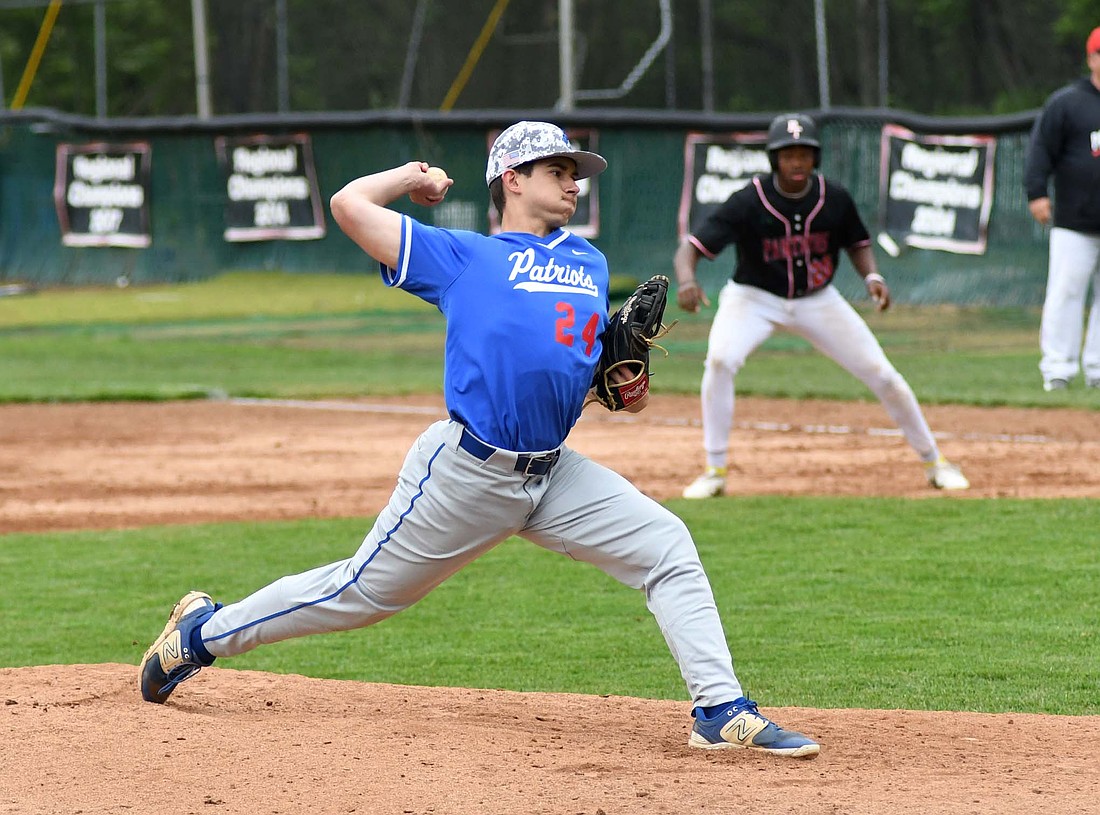 Jay County High School’s Camden Fraley hurls a pitch during the Patriots’ 8-2 loss to Park Tudor during the Wapahani Baseball Invite on Saturday. Fraley had to warm up at a moment’s notice after being called on to replace Brock Wasson, who left the game with an apparent ankle injury. (The Commercial Review/Andrew Balko)