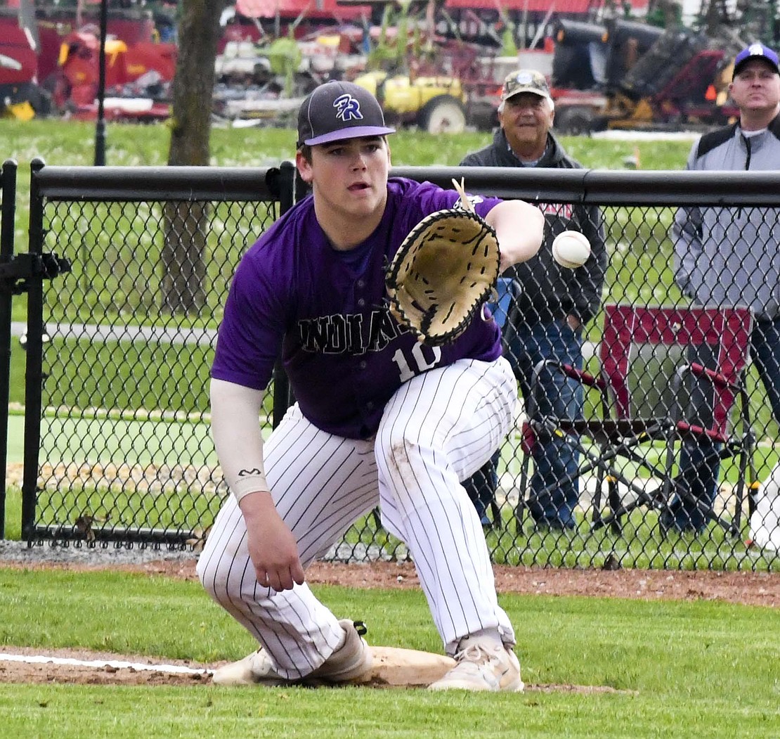 Fort Recovery first baseman Caden Homan receives a throw down from catcher Brodie Hart during the Tribe’s 10-0 victory Monday. (The Commercial Review/Andrew Balko)