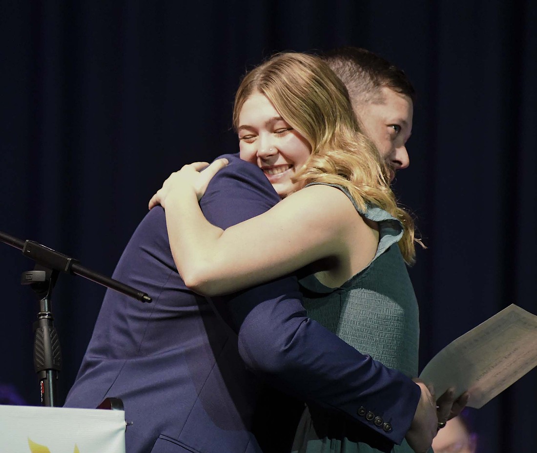 Jay County High School senior Maddy Snow hugs her uncle Matt Snow during Honors Night on Monday after he presented her with the Jay Lodge #87 Scholarship. (The Commercial Review/Ray Cooney)
