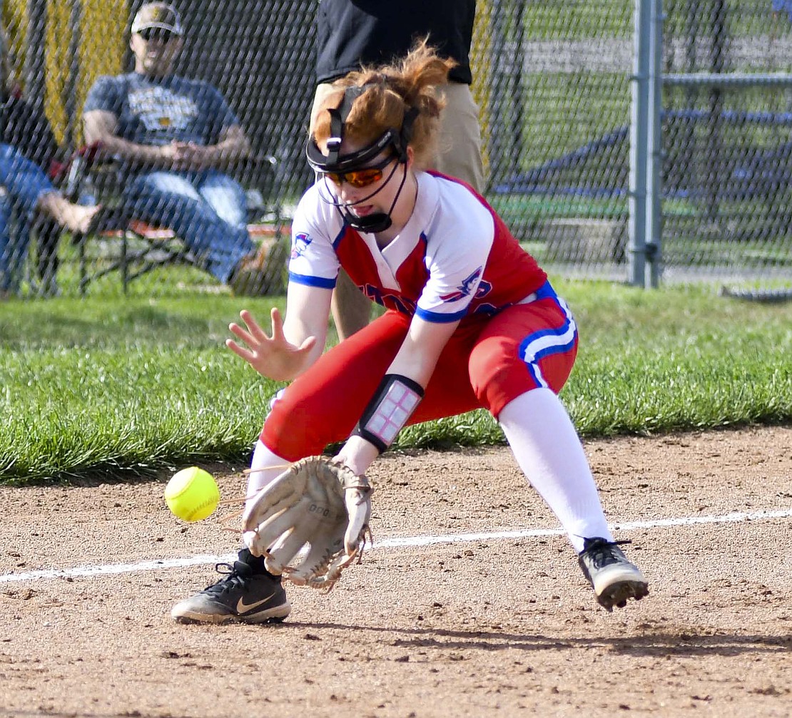 Jay County High School third baseman Chloe Brown fields a ground ball during Wednesday’s 3-1 loss to the Class 2A No. 5 South Adams Starfires. The Patriots kept mistakes to a minimum, only committing one error, which didn’t amount to any runs. (The Commercial Review/Andrew Balko)