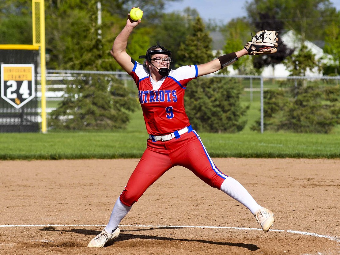 Mallory Winner lurches forward to fling a pitch to home plate during the Patriots’ 3-1 loss to the fifth-ranked Starfires on Wednesday. South Adams managed to get three runs from just three hits and three walks by Winner. (The Commercial Review/Andrew Balko)