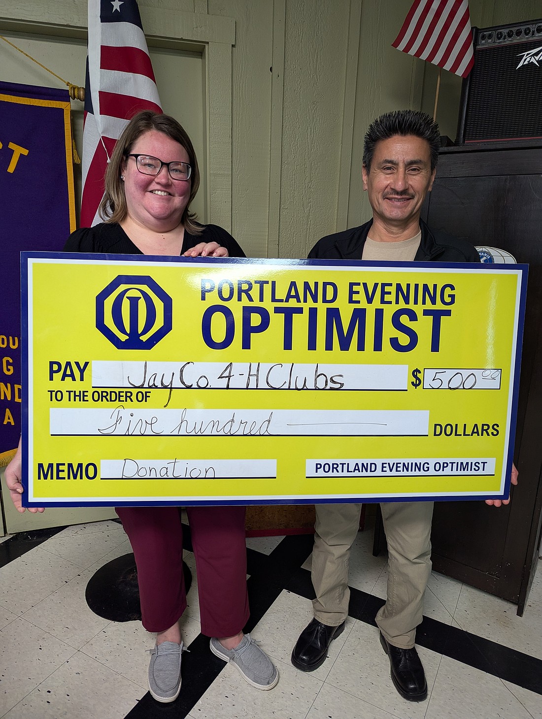 Portland Evening Optimist Club recently donated $500 to Jay County 4-H Clubs. Pictured above, from left, are Purdue Extension Office health and human sciences coordinator Ashley Drees and Evening Optimist Club president Bobby Ruiz. (Photo provided)