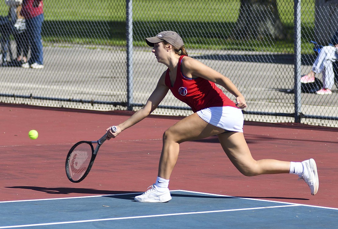 Jay County’s No. 1 singles player Brenna Bailey runs up to hit a low forehand during her 6-0, 6-0 sweep of Union City’s Ashley Garrett on Friday. The win moved Bailey to 10-0 on the season, just one win shy of her total from 2024, when she played the No. 2 singles position. (The Commercial Review/Andrew Balko)