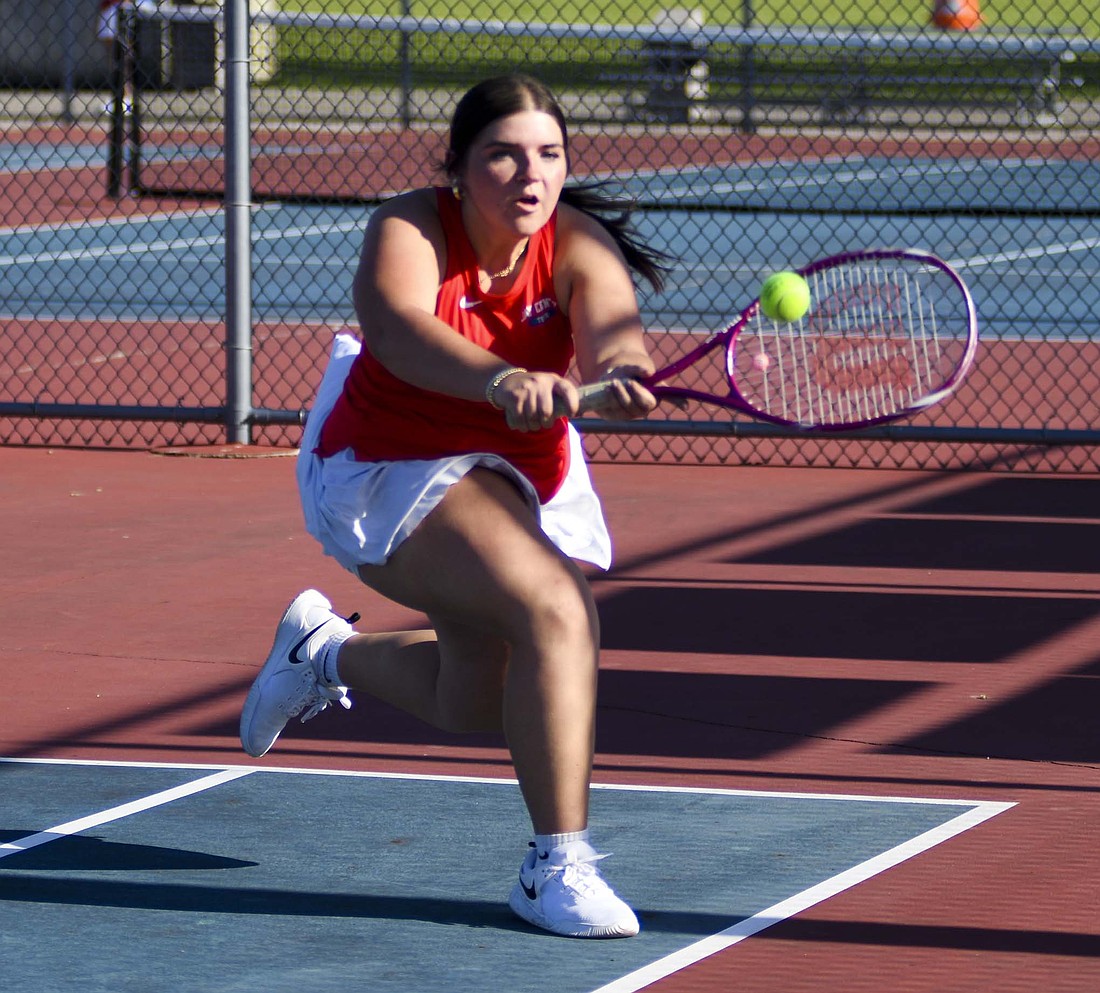 Jay County High School junior Lily Johnson connects on a backhand during her No. 3 singles match against Addison Thornburg of Union City on Friday. Johnson and Thornburg traded games in the second set before the Patriot won the tiebreaker to pick up her third win of the season 6-2, 7-6 (7-3) and complete the 5-0 JCHS sweep. (The Commercial Review/Andrew Balko)