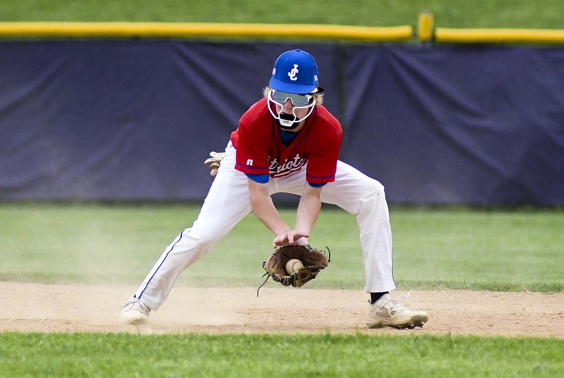 Jay County High School shortstop fields a ground ball in the bottom of the fifth inning in Monday’s 23-4 domination of the Muncie Central Bearcats. Byrum pitched two innings and drove in two runs on a single in the second inning to contribute to the JCHS victory. (The Commercial Review/Andrew Balko)