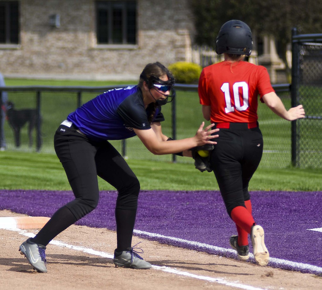 Alexis Grisez, the Fort Recovery High School softball team’s first baseman, tags out eighth-seeded Preble Shawnee’s Lily Jones halfway up the baseline during the OHSAA Division VI Southwest 2 sectional final on Tuesday. Grisez delivered a two-RBI single in the fourth inning open the scoring and helped lift the No. 5 seed Indians to a 4-0 victory. (The Commercial Review/Andrew Balko)
