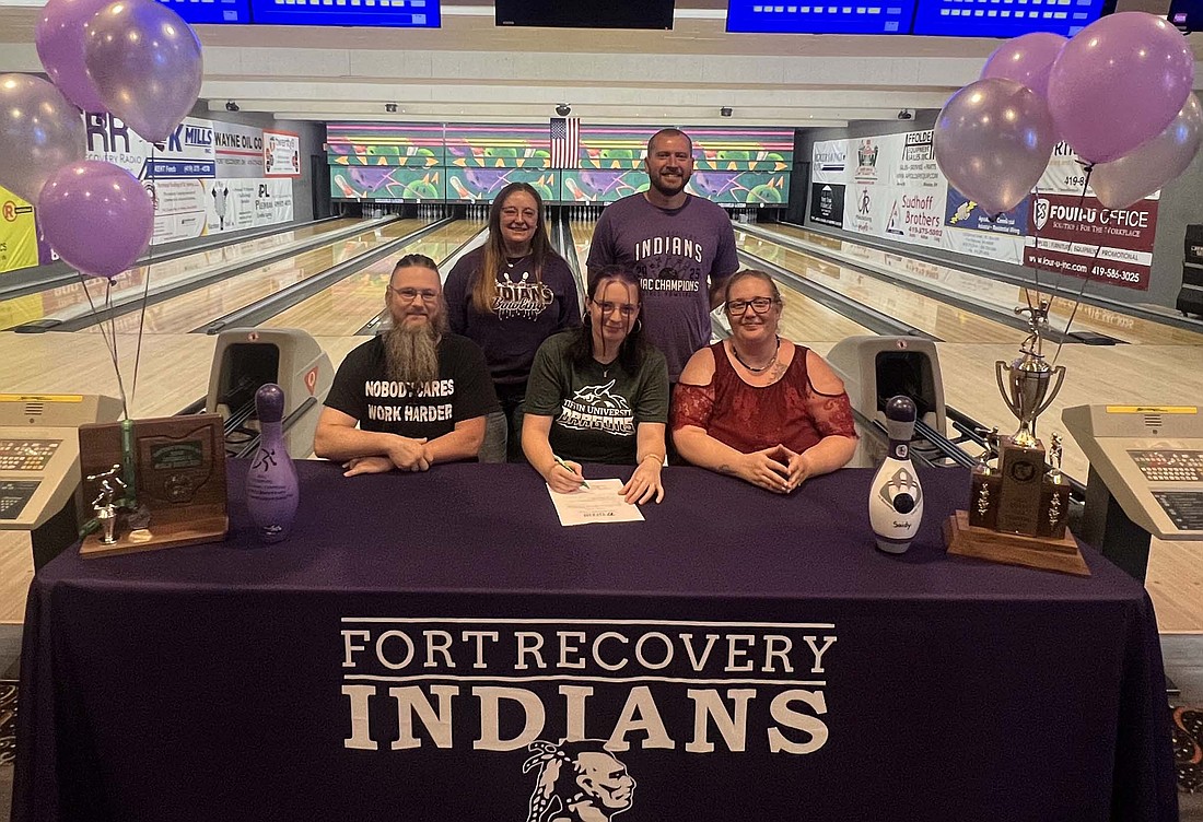 Saidy DeRoo signed her national letter of intent at Miracle Lanes on May 9 to join the women’s bowling team at Tiffin University. Pictured in the front row are Gary Coats, Saidy DeRoo and Laura DeRoo. Back row are Fort Recovery High School girls bowling coach Alison Rosegrant and assistant coach Steve Westgerdes. (Photo provided)