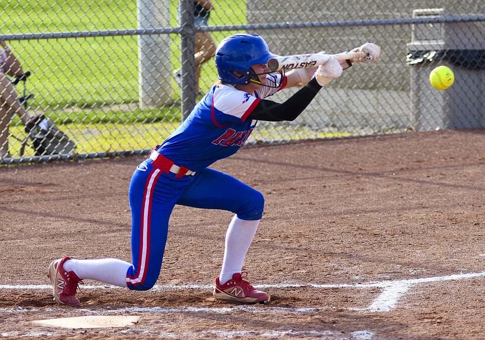 Brenna Ruble of Jay County lays down a sacrifice bunt during the Patriots’ win Thursday over Heritage. She also scored once as JCHS improved to 16-2. (The Commercial Review/Andrew Balko)