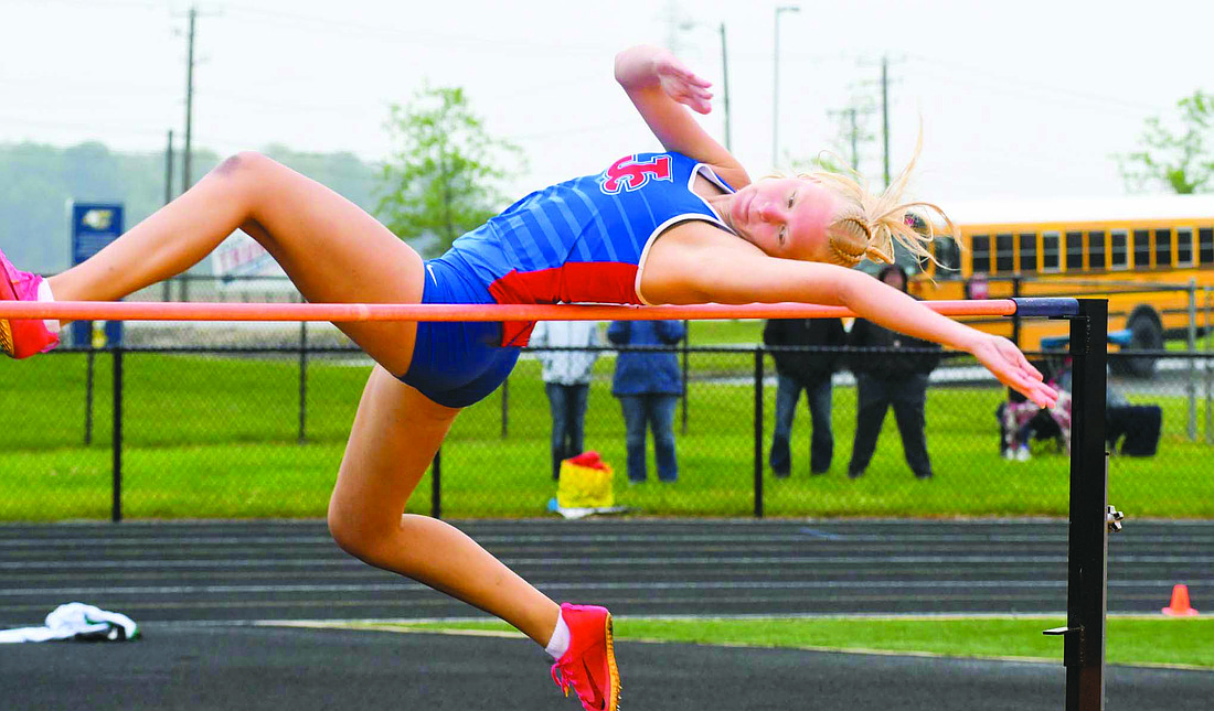 Jenna Dues of the Jay County High School girls track team attempts to get over the 4-foot, 10-inch bar during the IHSAA Sectional 12 meet at Delta on Tuesday. Dues cleared the bar on her second attempt, earning her third place and a spot at the regional meet. The Patriots totalled 106 points to trail only Yorktown (152.5) and Delta (129). (The Commercial Review/Andrew Balko)