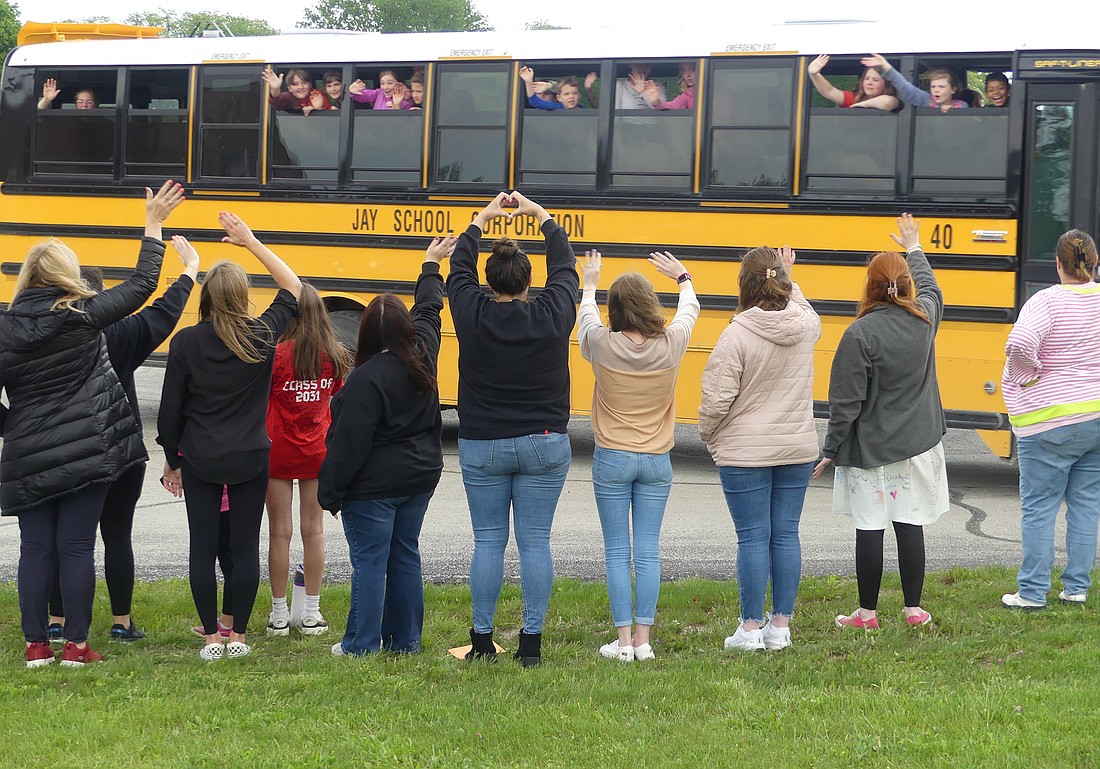 The last day of school at Bloomfield wouldn't be complete without all of the faculty lining the front yard to wave goodbye to their students for the summer. (Lindy Mercer)
