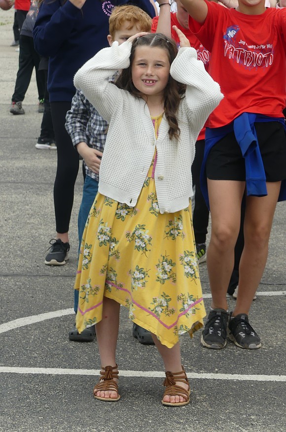 Second grader, Madilyn Laux, age 8, dances to the "Macarena" during Bloomfield Elementary's last day of school celebration on Friday. (Lindy Mercer)