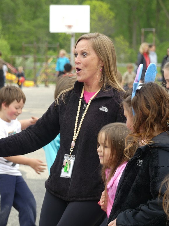 Kindergarten teacher, Carrie Byrum, celebrates with her students on the last day of school. (Lindy Mercer)