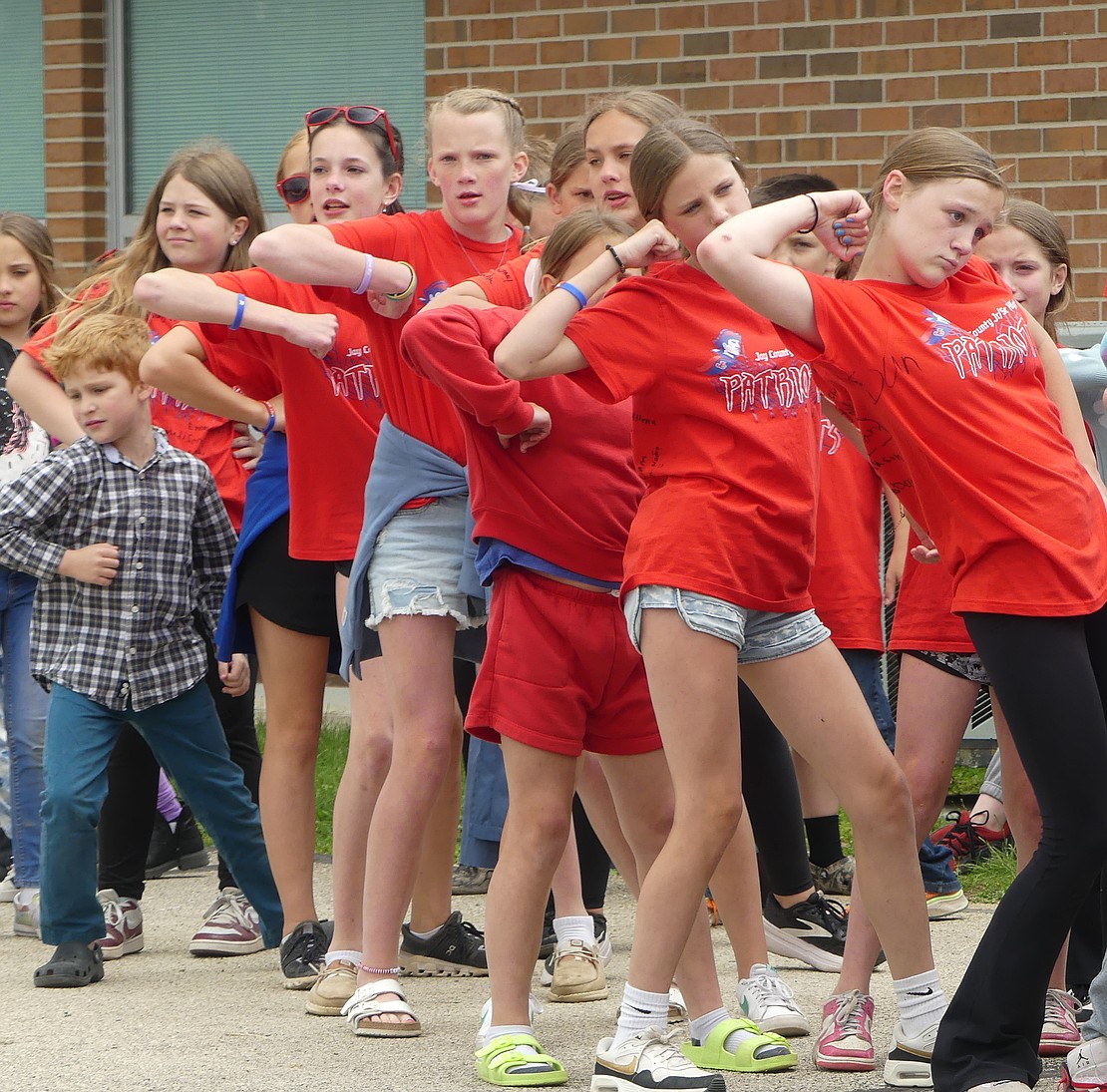 A group of sixth-grade students performs "The Hokey Pokey" during Bloomfield's last day of school celebration. (Lindy Mercer)