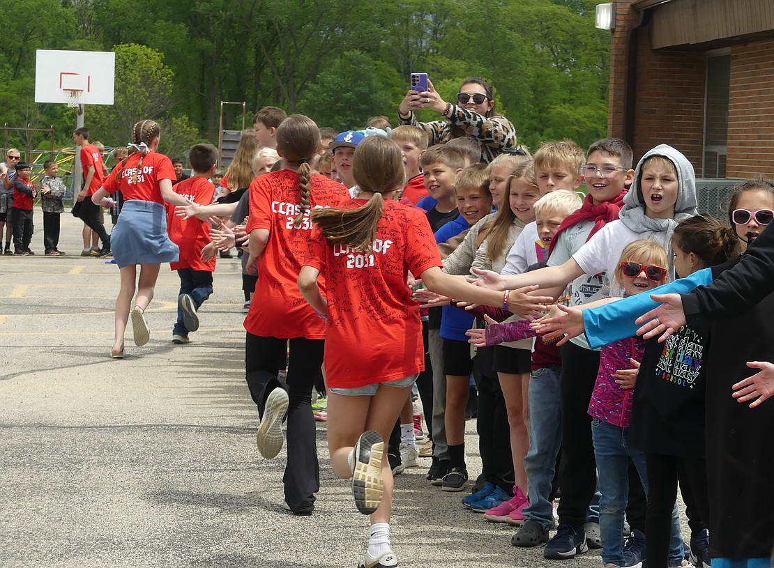 Bloomfield Elementary has many traditions, one of them being the sixth graders running a lap to high-five all of the underclassmen on the last day of school. In the fall, these students will start at the Jay County Jr.-Sr. High School. (Lindy Mercer)