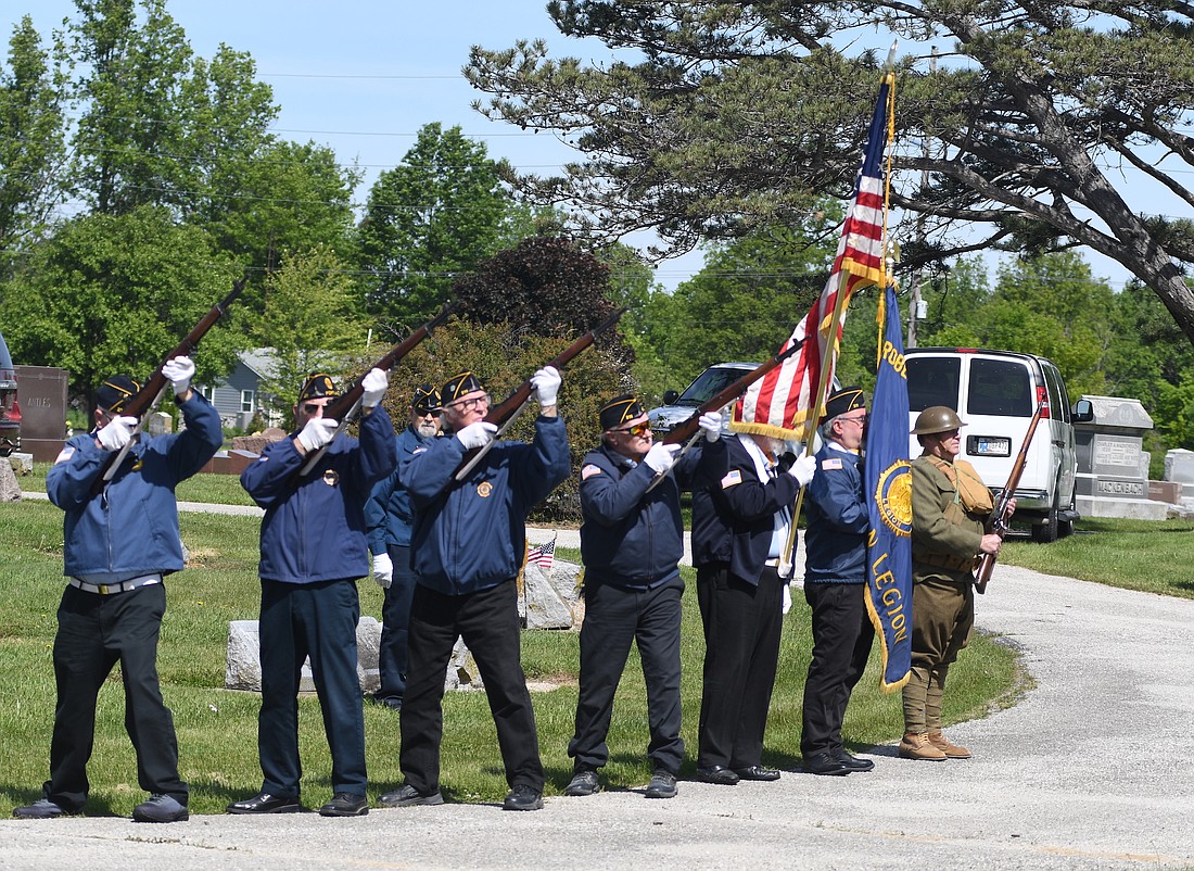 Members of the Robert Guy Ayers American Legion Post 211 perform a 21-gun salute Monday during a Memorial Day ceremony at Green Park Cemetery in Portland. Pastor Darrell Borders shared some of the history of the holiday with those in attendance, including that it was first introduced as Decoration Day in 1868. (The Commercial Review/Ray Cooney)