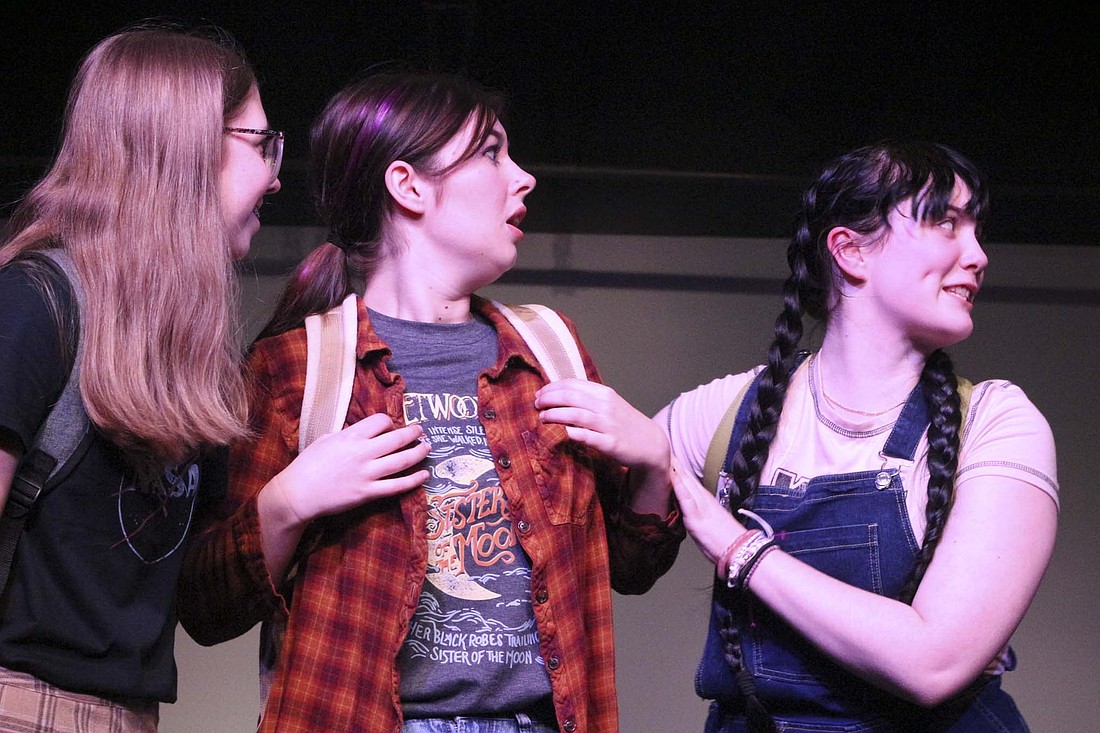 Esther Crandall (Hannah), Inara Sanderson (Ellie Blake) and Ali McGraw (Gretchen) brace themselves during “Freaky Friday” rehearsal Thursday at Arts Place. “Ellie is very messy and just very like outgoing and sporadic,” Sanderson said. “She’s a cranky teenager who doesn’t want to listen to her mom.” (The Commercial Review/Bailey Cline)