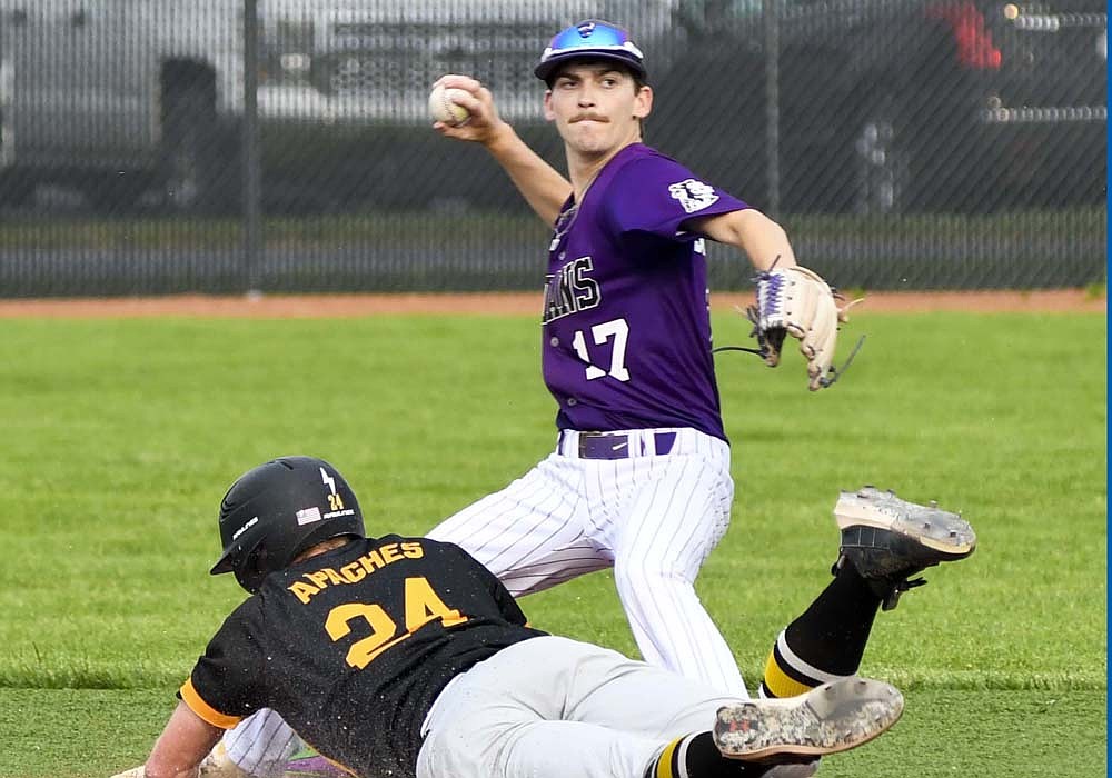 Fort Recovery High School’s Austin Siegrist starts to throw the baseball to first base after fielding it and stepping on second to get Fairview’s Drayden Grinnell-Dennis out on Wednesday. The Tribe lost to FHS 7-1 in the OHSAA Division VI Region 24 final at Newton. (The Commercial Review/Andrew Balko)