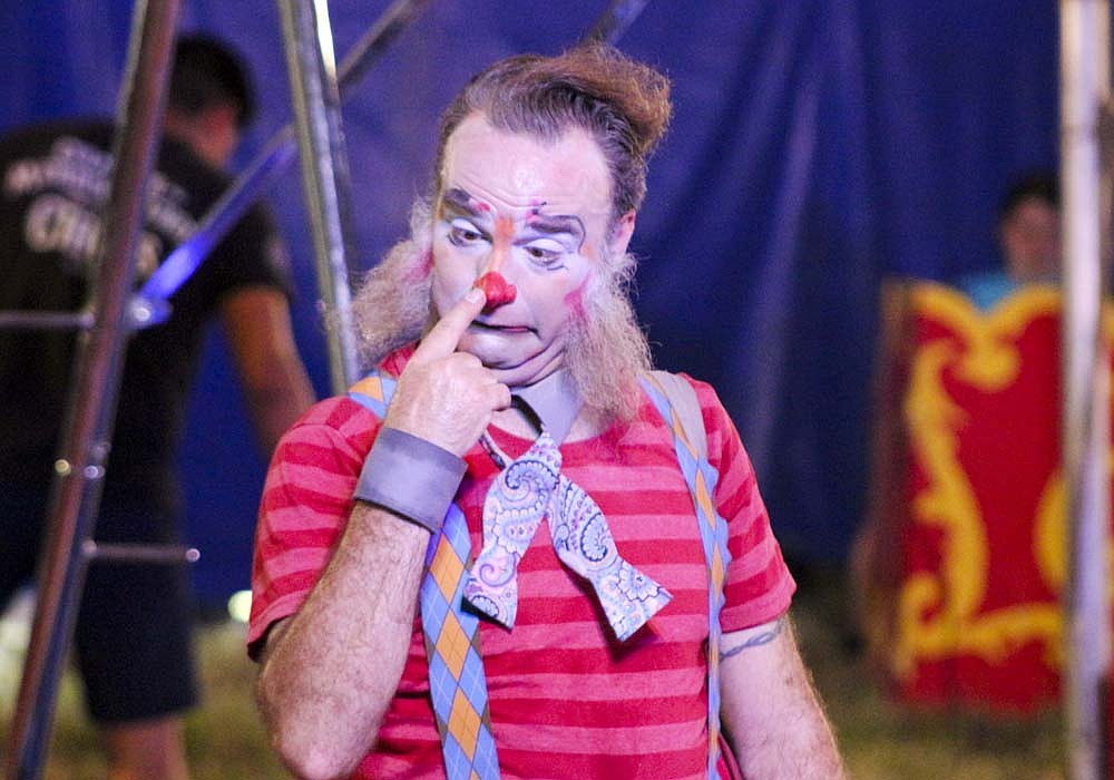 Leo the clown touches his nose Tuesday during the Culpepper & Merriweather Circus show in Redkey. He invited a few different guests on stage, including 6-year-old Kassidy Kirby of Redkey and OJ Bailey of Portland, to perform comedy acts with him. (The Commercial Review/Bailey Cline)