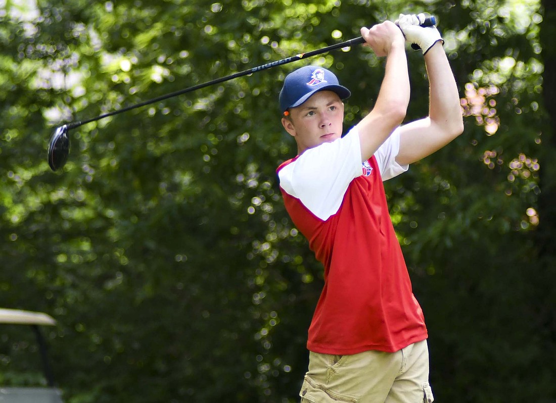 Jay County High School senior Griffin Byrum follows through on his tee shot at the 14th hole of the IHSAA Regional 4 boys golf meet hosted by Muncie Central at The Players Club on Thursday. Byrum, the only Patriot to qualify for the regional, finished with a score of 110 strokes. (The Commercial Review/Andrew Balko)