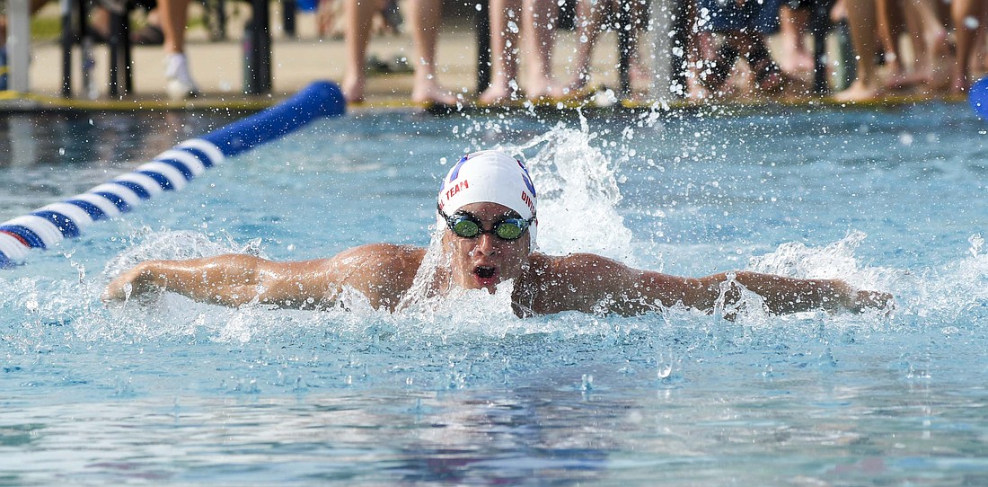 Grant Glentzer swims the butterfly as part of the 13-14-year-old 200-meter medley relay team during Monday’s meet between the Jay County Summer Swim team and the Fort Recovery Eels at Portland Water Park. Glentzer won a trio of events to help the Patriots to a 693-310 victory. (Th Commercial Review/Andrew Balko)