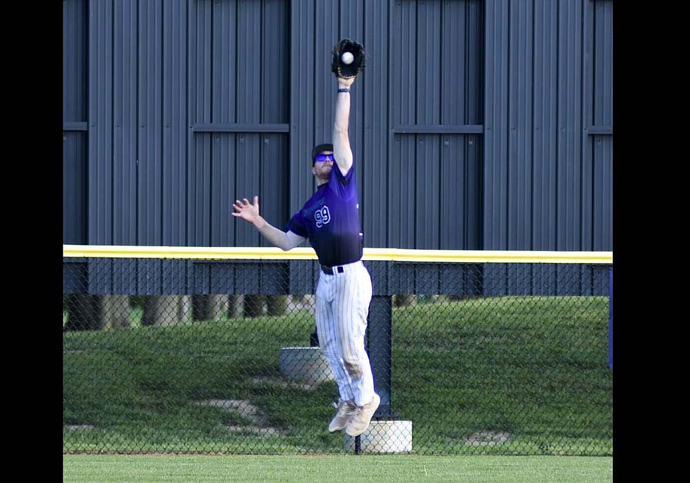 Fort Recovery center fielder Reece Wendel leaps to snag a line drive during the ACME baseball team’s 3-0 win over St. Henry on Thursday. Wendel doubled up a runner on third base on the catch, and scored the winning run in the sixth inning. (The Commercial Review/Andrew Balko)