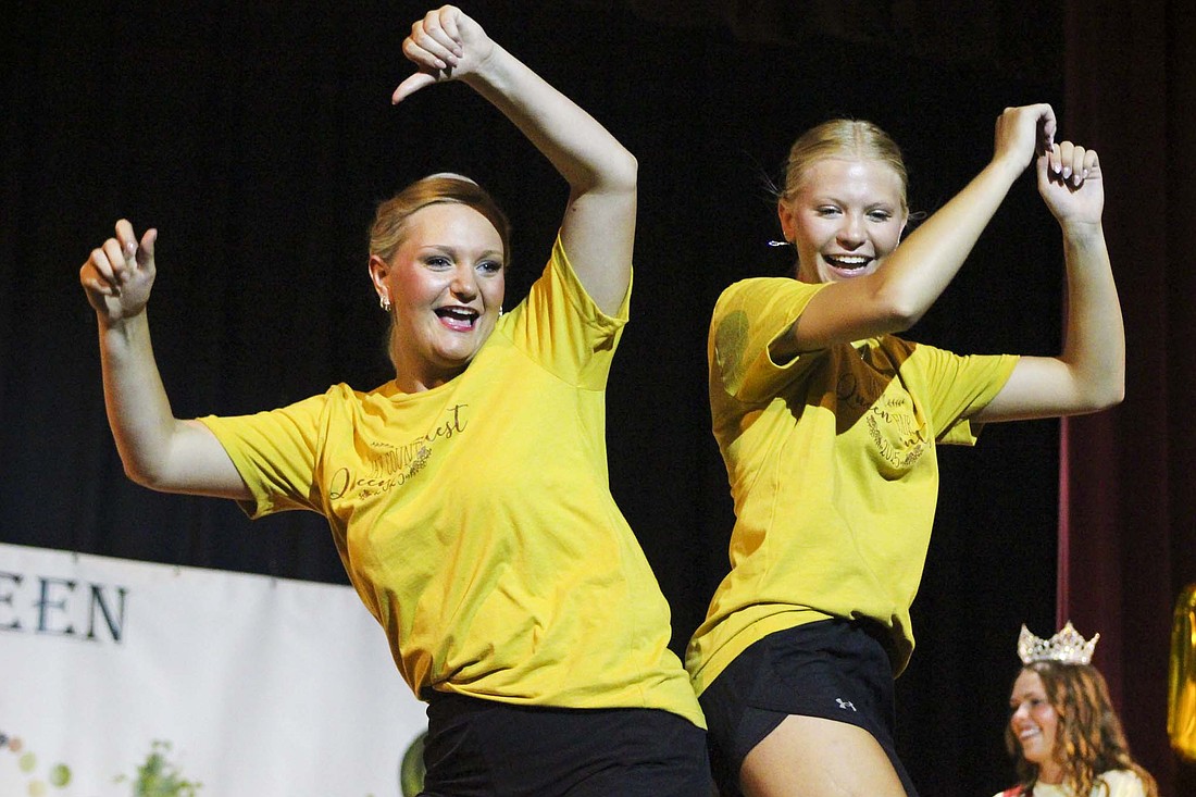 Kenzie Huey and Jenna Dues bump hips Sunday during a performance for the Miss Jay County Fair Queen Pageant. Contestants as well as the 2024 court members danced on stage while judges deliberated. (The Commercial Review/Bailey Cline)