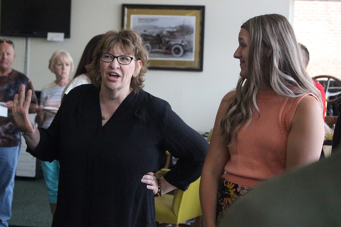 Jay County Development Corporation executive director Ceann Bales chats with Chelsea Bollenbacher, a senior accountant with Bollenbacher & Associates, during a meet and greet event Tuesday. Bales and new Jay County Chamber of Commerce executive director Amanda Blair met with community members at Community Resource Center. (The Commercial Review/Bailey Cline)